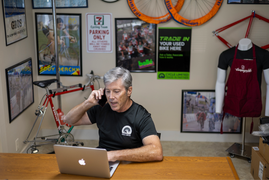 cycle limited employee/bike sensei taking a phone call with a customer