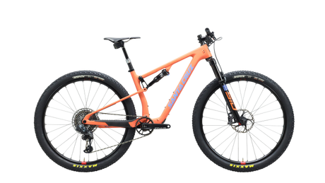 light orange/salmon colored mountain bike