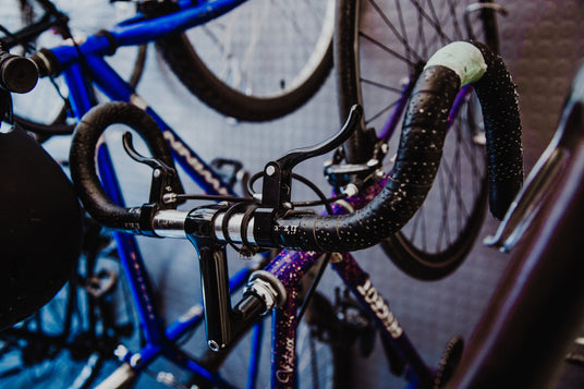 purple bicycle displayed in a bike shop